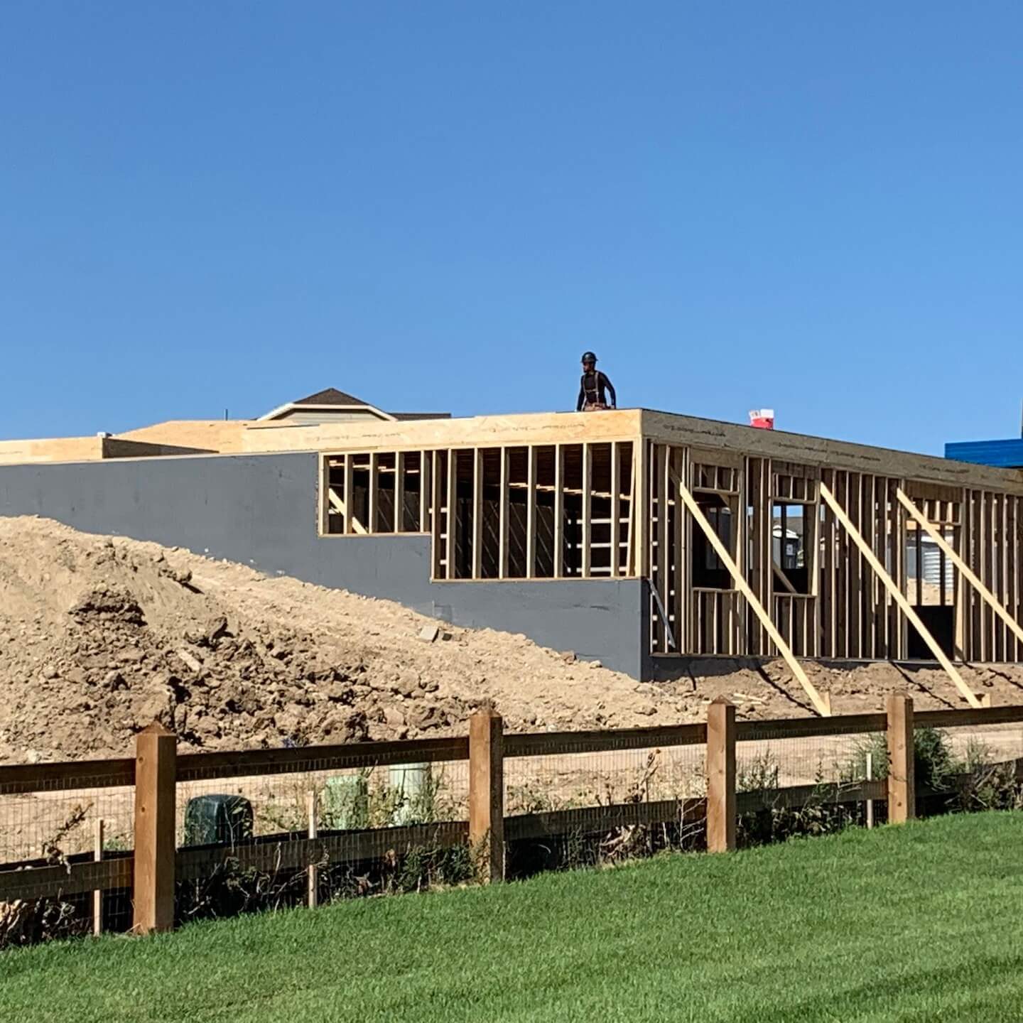 building being put together with wood slabs and concrete