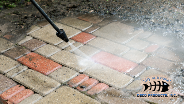 pavement being cleaned with power cleaner