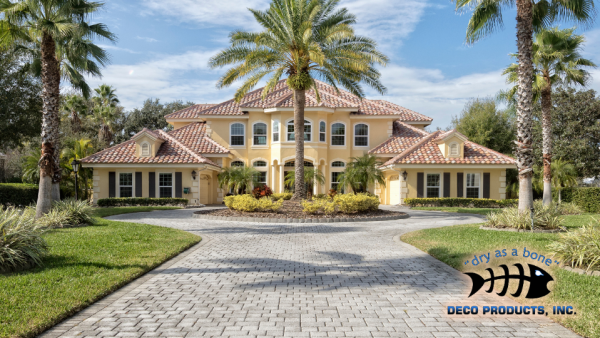 _Deco website repair your pavers before you seal A large yellow home with a round driveway