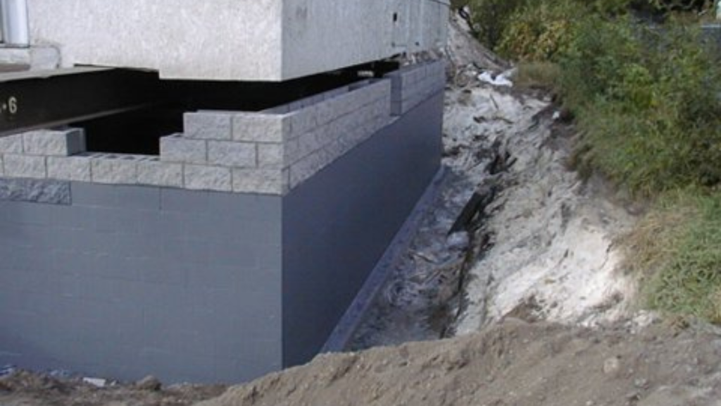 a concrete structure with bricks in the process of construction