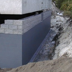 a concrete structure with bricks in the process of construction