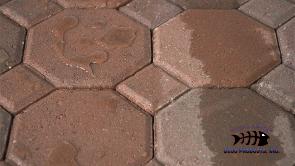 close up of hexagon blocks on ground with water droplets on them